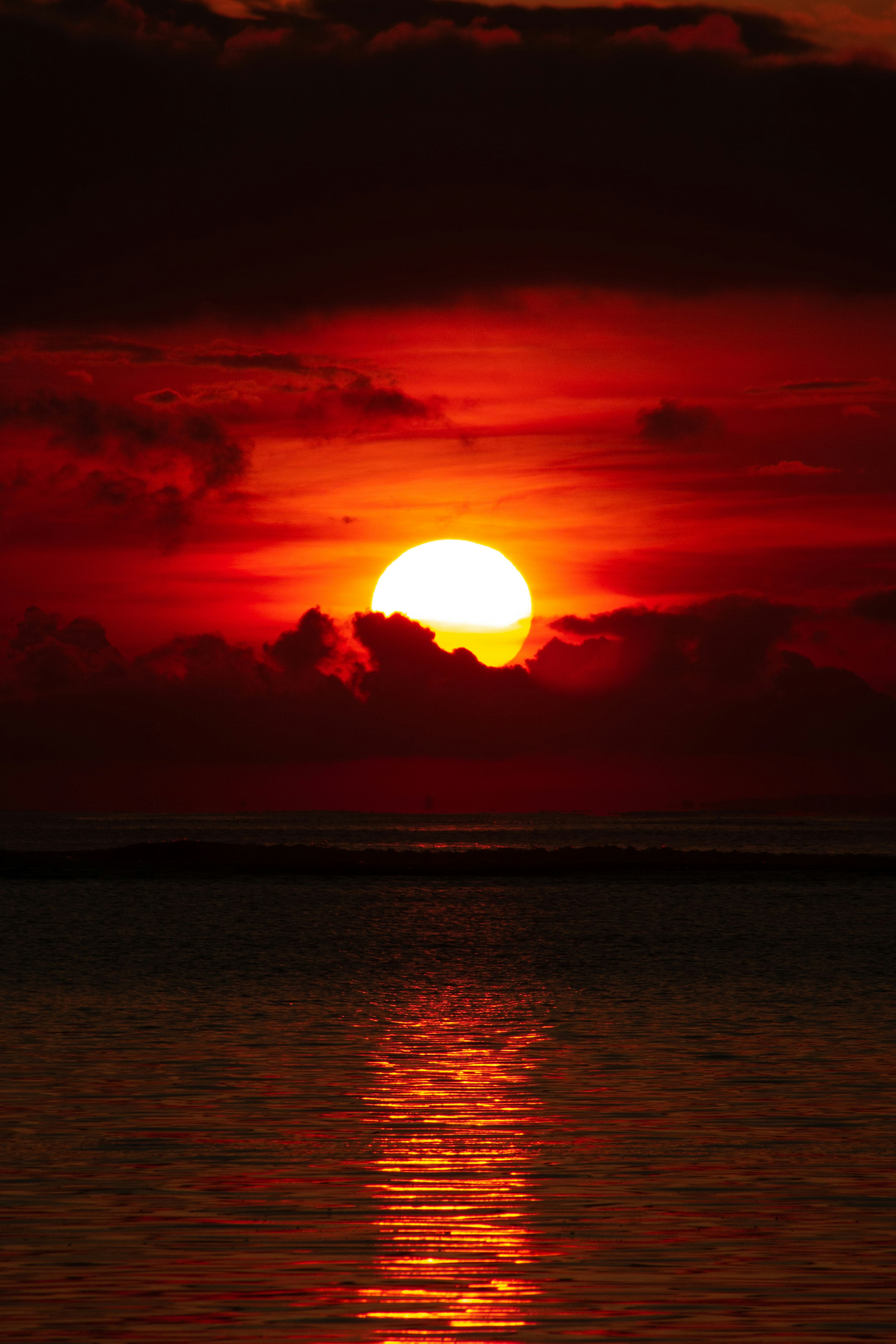 body of water during sunset